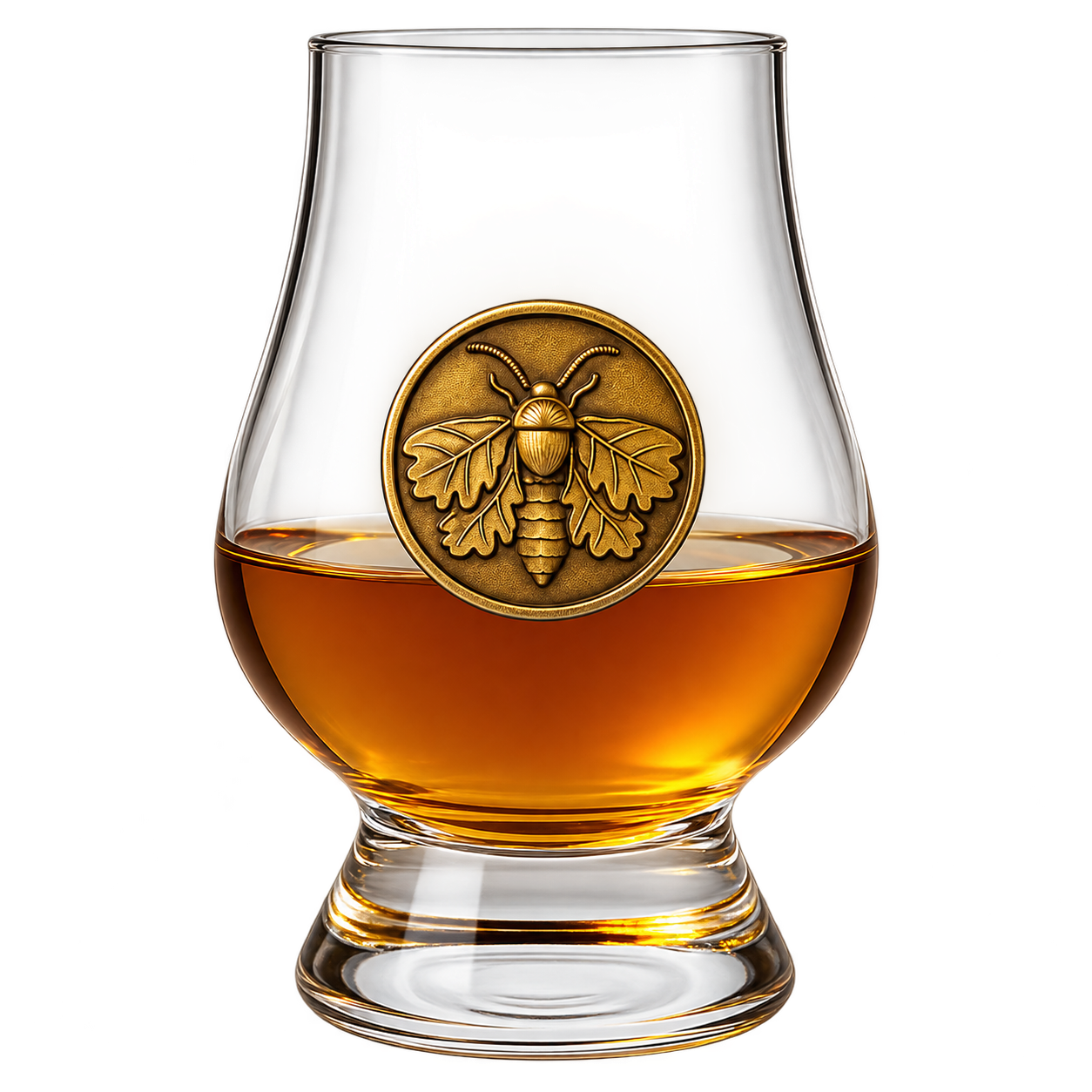 Neat Pommeau in a Glencairn glass with Stillbound’s gold moth medallion